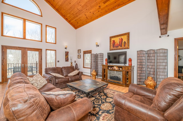 575 Hallowell Rd, Chelsea, ME 04330 - living area featuring wooden ceiling, high vaulted ceiling, wood finished floors, french doors, and a fireplace