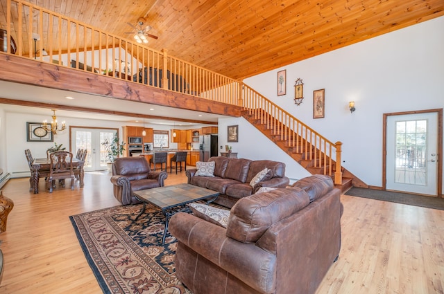 575 Hallowell Rd, Chelsea, ME 04330 - living area featuring a high ceiling, a chandelier, stairs, light wood-style floors, and a ceiling fan