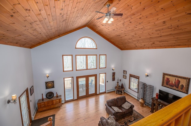 575 Hallowell Rd, Chelsea, ME 04330 - living room featuring french doors, high vaulted ceiling, light wood-type flooring, a ceiling fan, and wooden ceiling