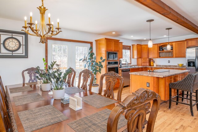 575 Hallowell Rd, Chelsea, ME 04330 - dining space featuring light wood-style flooring, a chandelier, and recessed lighting
