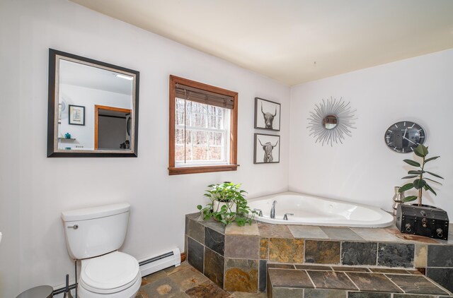 575 Hallowell Rd, Chelsea, ME 04330 - bathroom with a baseboard heating unit, stone tile flooring, toilet, and a garden tub