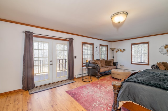 575 Hallowell Rd, Chelsea, ME 04330 - bedroom featuring multiple windows, french doors, access to exterior, a baseboard heating unit, and crown molding