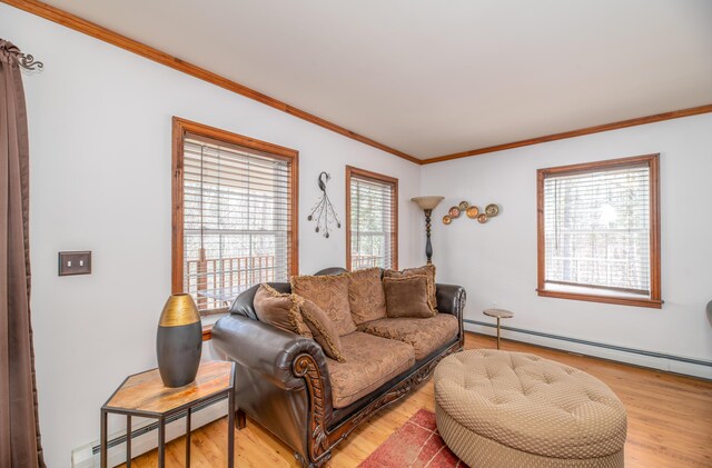 575 Hallowell Rd, Chelsea, ME 04330 - living area with baseboard heating, ornamental molding, and light wood-style floors