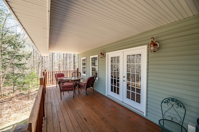 575 Hallowell Rd, Chelsea, ME 04330 - wooden terrace with french doors and outdoor dining space