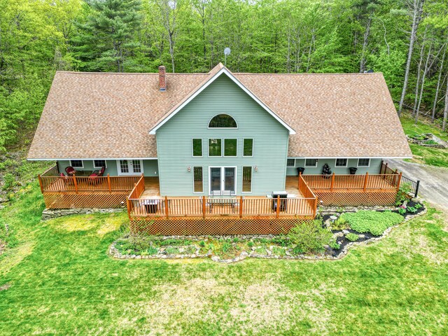 575 Hallowell Rd, Chelsea, ME 04330 - back of house featuring roof with shingles, a deck, and a lawn