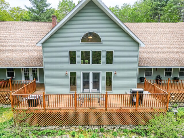 575 Hallowell Rd, Chelsea, ME 04330 - rear view of property with roof with shingles, a chimney, and a wooden deck