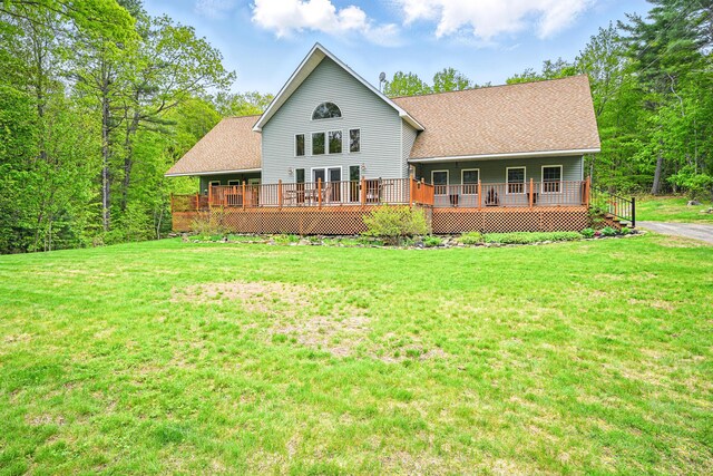 575 Hallowell Rd, Chelsea, ME 04330 - back of property with a yard, a wooden deck, and a shingled roof