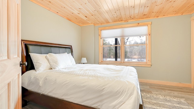 18 Lovers Ln, Bethel, ME 04217 - bedroom featuring baseboards, wooden ceiling, and wood finished floors