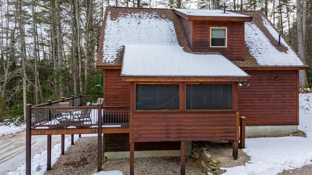 18 Lovers Ln, Bethel, ME 04217 - snow covered house with a wooden deck