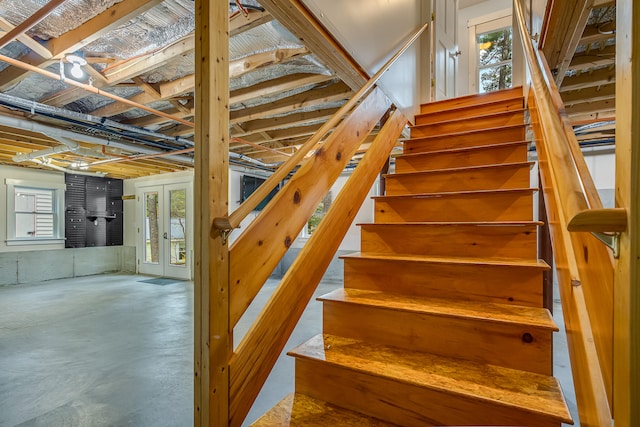 480 E Shore Dr, Acton, ME 04001 - stairs with french doors and concrete floors
