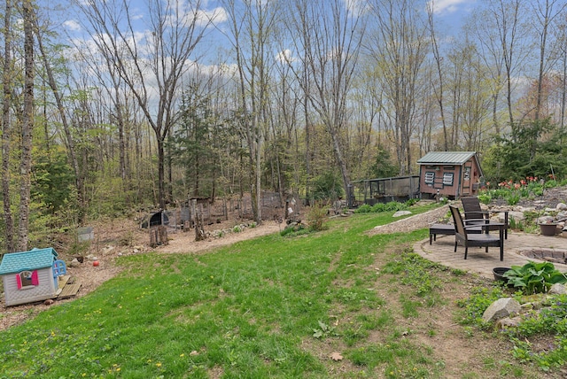 14 Stonebrook Rd, Windham, ME 04062 - view of green lawn with a storage unit and an outbuilding
