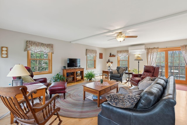 14 Stonebrook Rd, Windham, ME 04062 - living area with a wall unit AC, light wood-style floors, a ceiling fan, and baseboard heating