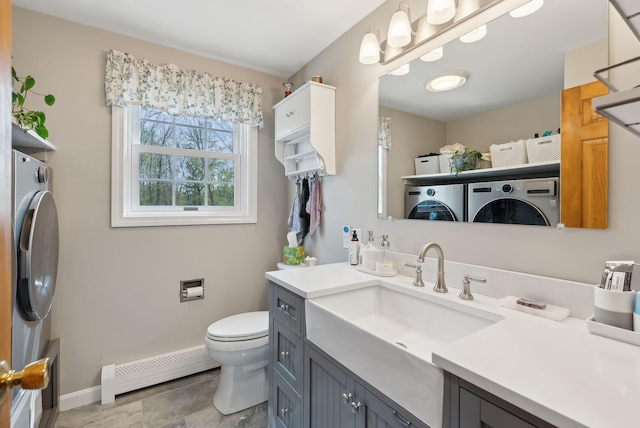 14 Stonebrook Rd, Windham, ME 04062 - bathroom with baseboard heating, toilet, vanity, and baseboards