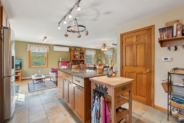 14 Stonebrook Rd, Windham, ME 04062 - kitchen featuring stainless steel refrigerator with ice dispenser, a baseboard radiator, track lighting, a wall mounted AC, and ceiling fan