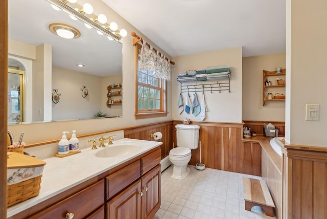 14 Stonebrook Rd, Windham, ME 04062 - full bath with wainscoting, vanity, toilet, and tile patterned floors