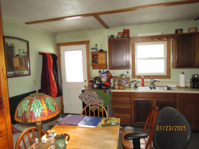 kitchen featuring a sink and light countertops