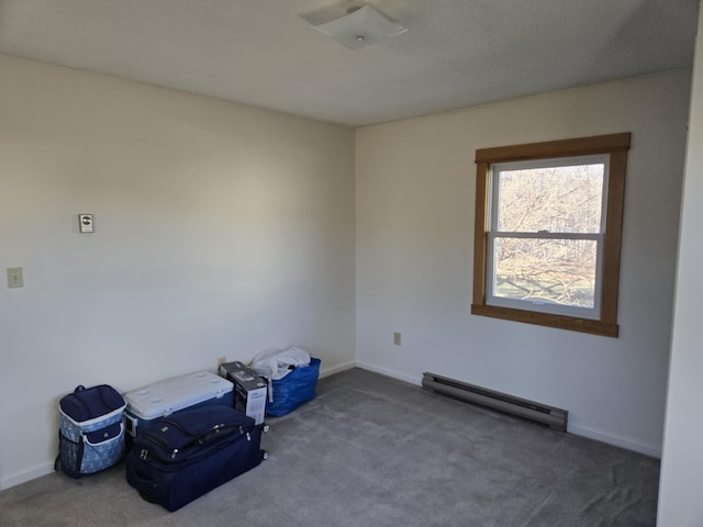 unfurnished room with baseboards, carpet, and baseboard heating