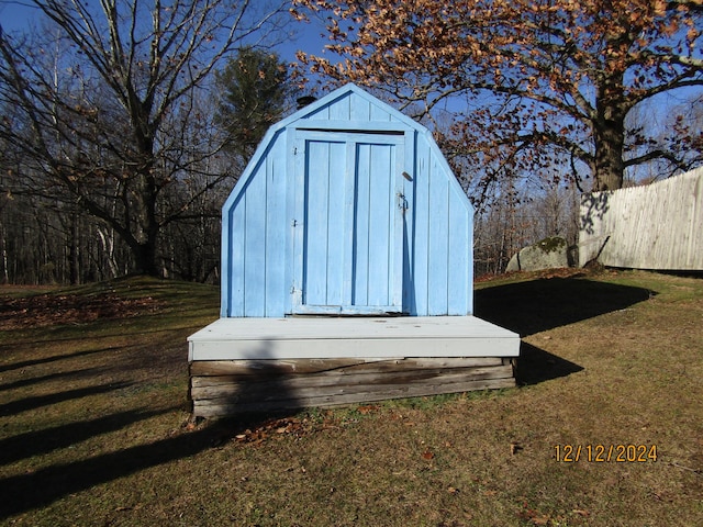 view of shed with fence