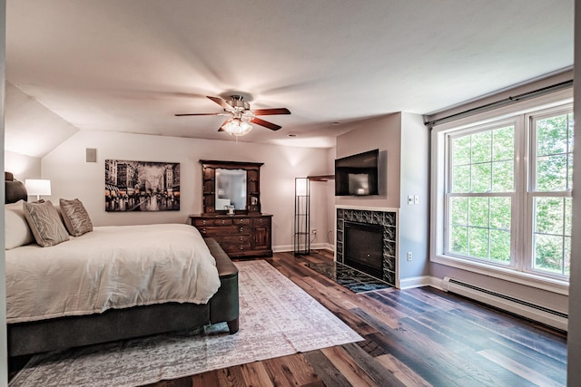 18 Sheila Cir, Saco, ME 04072 - bedroom with a baseboard radiator, wood finished floors, baseboards, a premium fireplace, and ceiling fan
