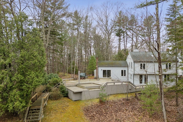 12 Bufflehead Cove Ln, Kennebunk, ME 04043 - rear view of house with roof with shingles, a chimney, a deck, and stairs