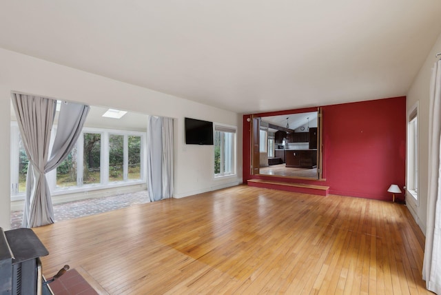 12 Bufflehead Cove Ln, Kennebunk, ME 04043 - unfurnished living room with light wood finished floors