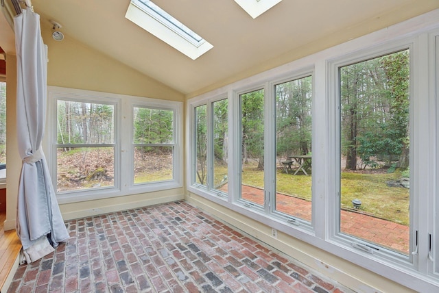 12 Bufflehead Cove Ln, Kennebunk, ME 04043 - unfurnished sunroom featuring plenty of natural light, brick floor, and vaulted ceiling with skylight