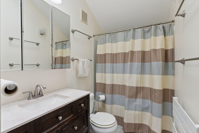12 Bufflehead Cove Ln, Kennebunk, ME 04043 - full bathroom with toilet, lofted ceiling, a shower with curtain, vanity, and visible vents