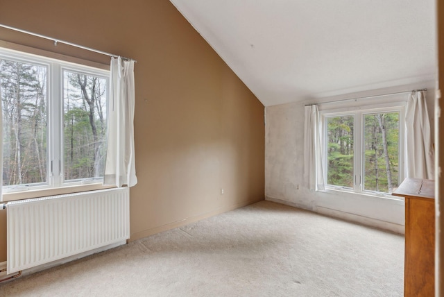 12 Bufflehead Cove Ln, Kennebunk, ME 04043 - spare room with lofted ceiling, radiator, and carpet floors
