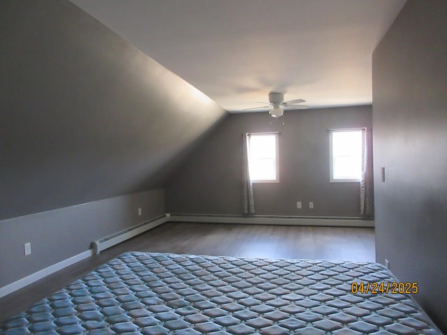 304 Main St, Jonesport, ME 04649 - additional living space featuring lofted ceiling, a baseboard radiator, ceiling fan, baseboards, and wood finished floors