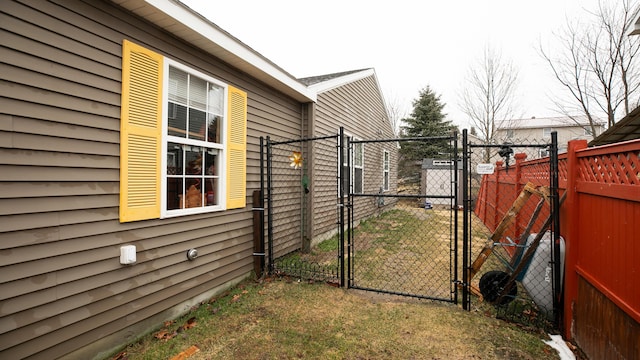 view of yard featuring fence and a gate