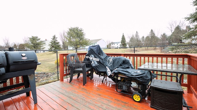 wooden terrace featuring fence and area for grilling