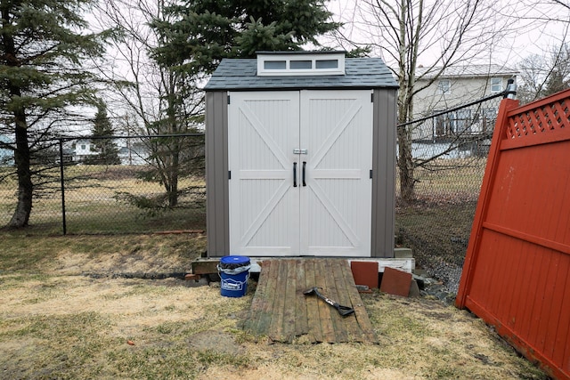 view of shed featuring a fenced backyard