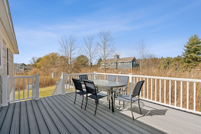 wooden deck with outdoor dining area