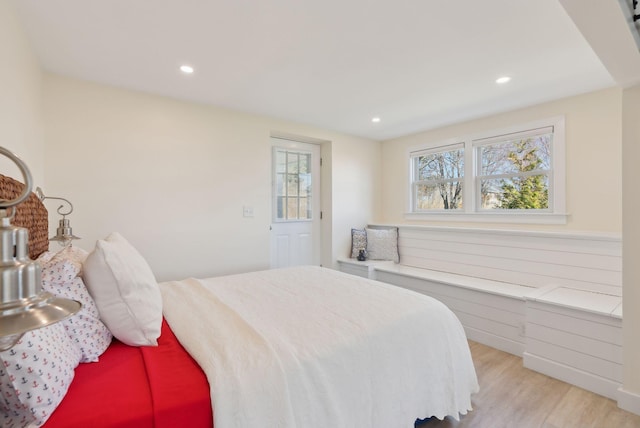 bedroom with recessed lighting and wood finished floors