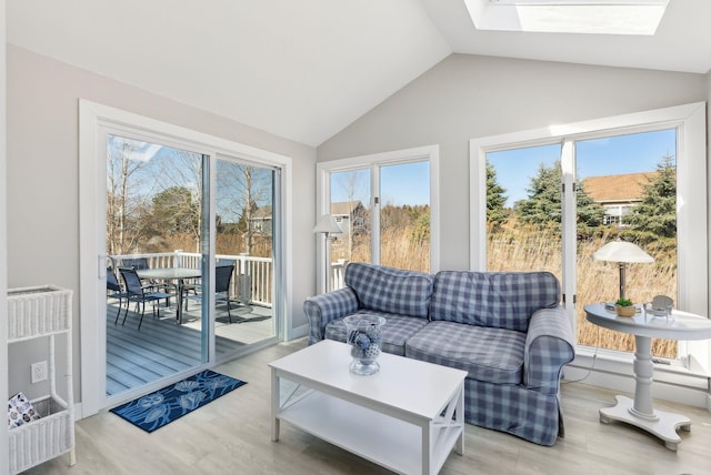 sunroom with a skylight and a healthy amount of sunlight