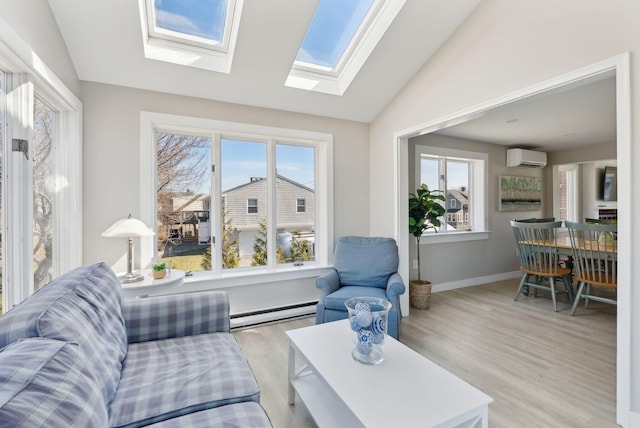 living room featuring baseboard heating, lofted ceiling with skylight, wood finished floors, and a wealth of natural light