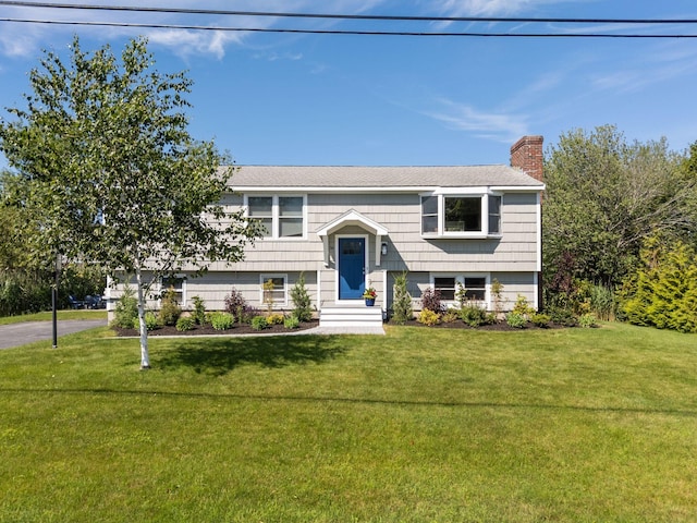 36 Surf Ln, Kennebunk, ME 04043 - raised ranch with a chimney and a front yard