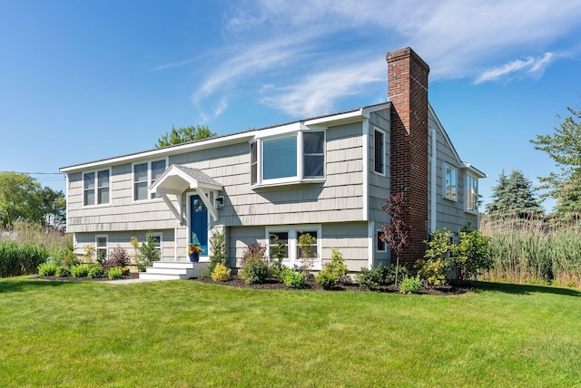 36 Surf Ln, Kennebunk, ME 04043 - bi-level home with a chimney and a front lawn