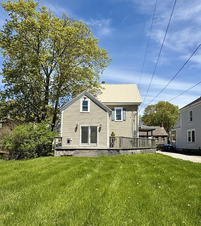 68 Washington St, Eastport, ME 04631 - rear view of house featuring a yard and a deck
