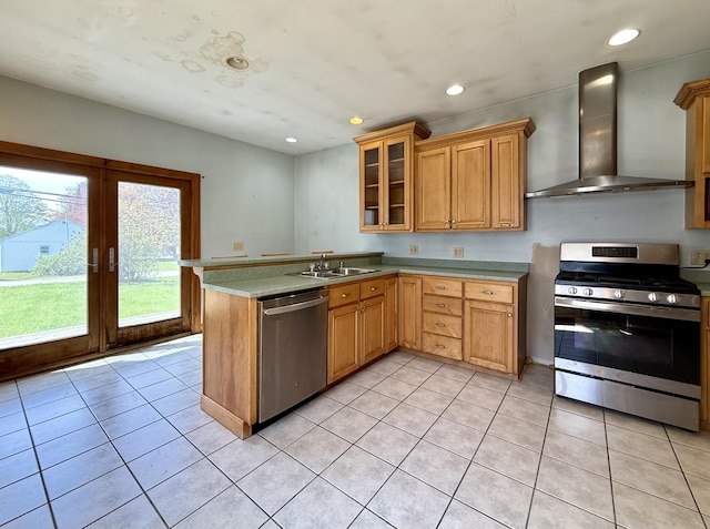 68 Washington St, Eastport, ME 04631 - kitchen with appliances with stainless steel finishes, wall chimney range hood, light tile patterned floors, light countertops, and recessed lighting