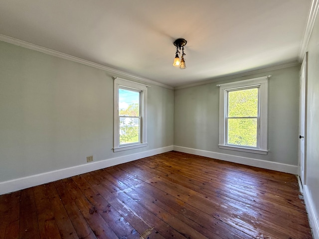 68 Washington St, Eastport, ME 04631 - empty room featuring baseboards, dark wood-style floors, and crown molding