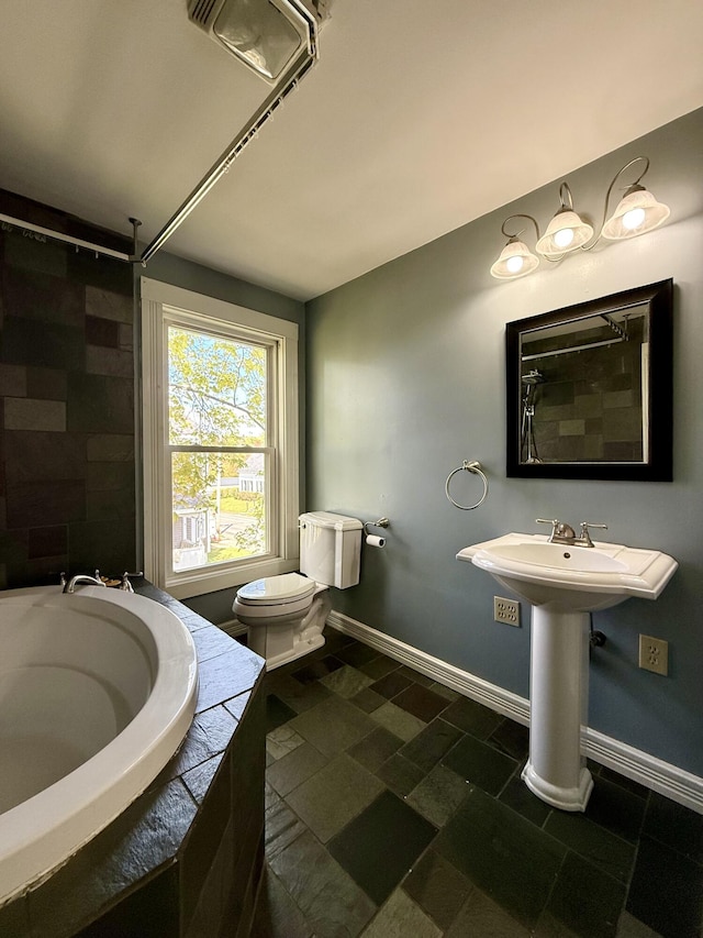 68 Washington St, Eastport, ME 04631 - full bathroom with tiled tub, toilet, baseboards, and a shower