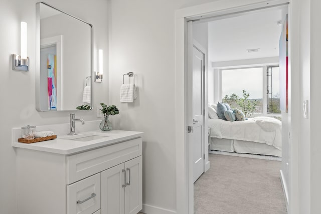 267 US Route 1 Ph 508, Falmouth, ME 04105 - bathroom with vanity, baseboards, and connected bathroom