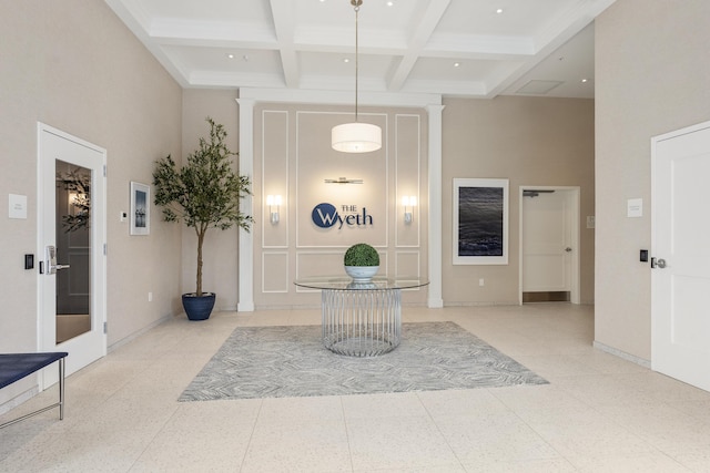 267 US Route 1 Ph 508, Falmouth, ME 04105 - foyer entrance with a towering ceiling, baseboards, beam ceiling, and coffered ceiling