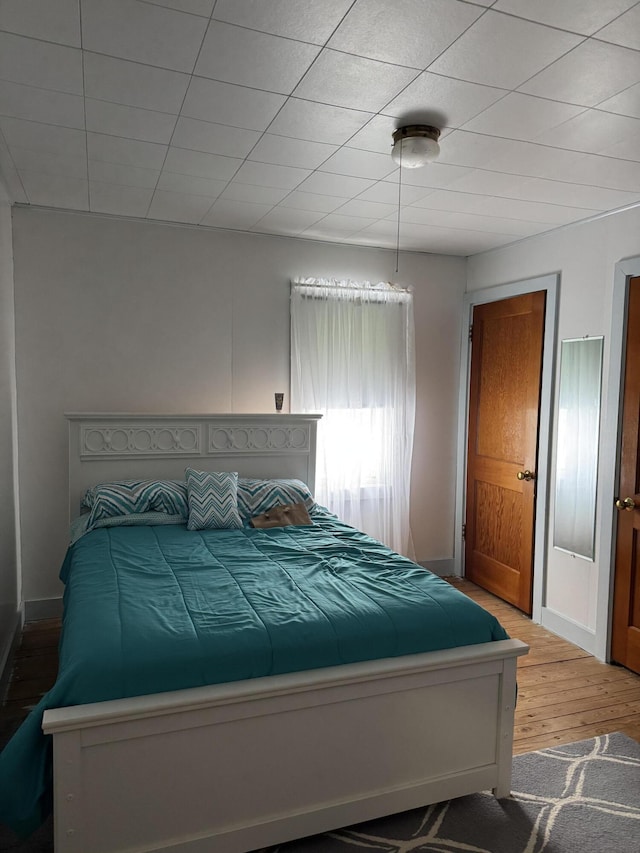 11 Pleasant St, Limestone, ME 04750 - bedroom with baseboards and light wood-type flooring