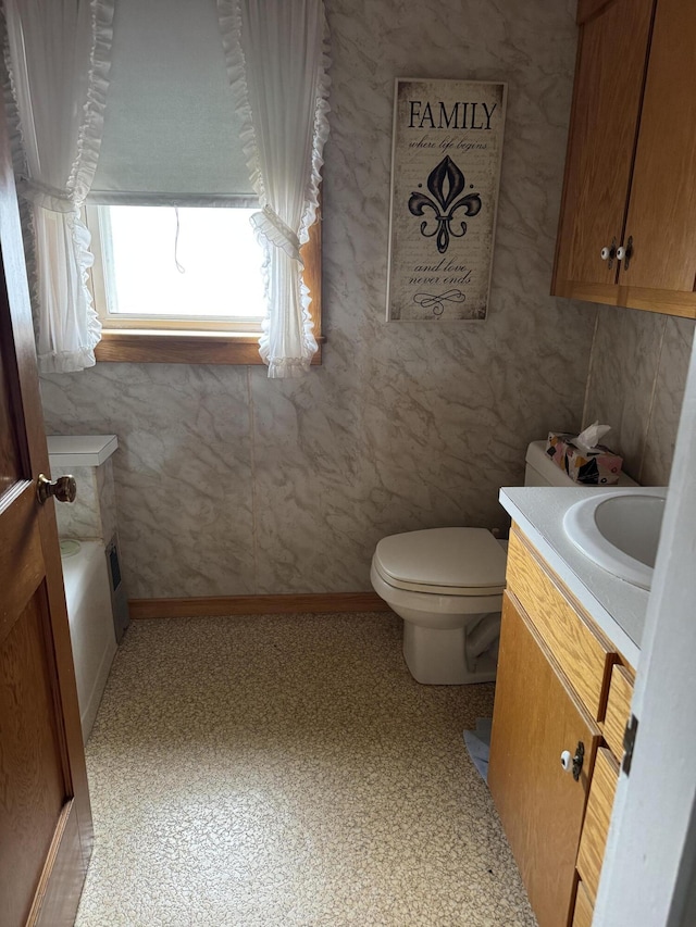 11 Pleasant St, Limestone, ME 04750 - bathroom with vanity, toilet, and baseboards