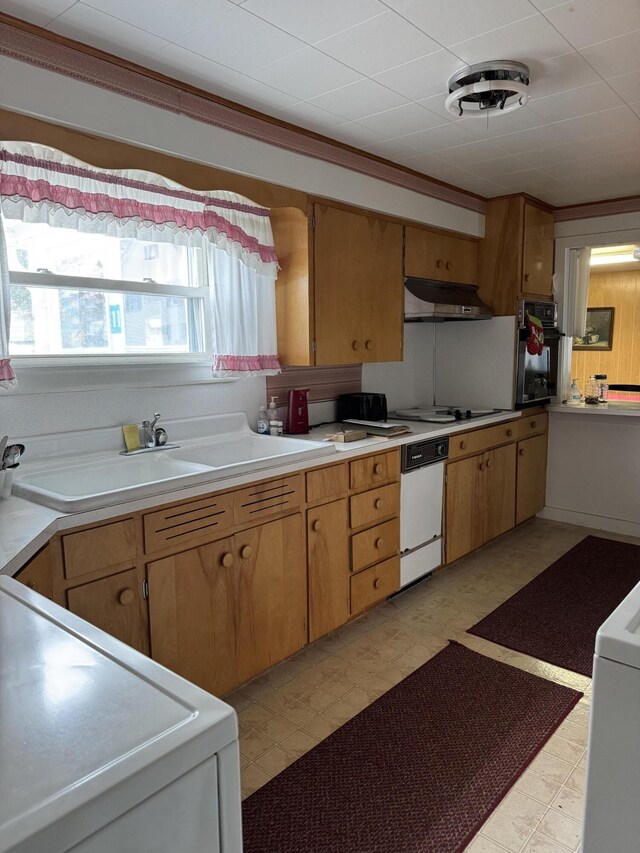 11 Pleasant St, Limestone, ME 04750 - kitchen with a sink, light floors, white appliances, under cabinet range hood, and light countertops
