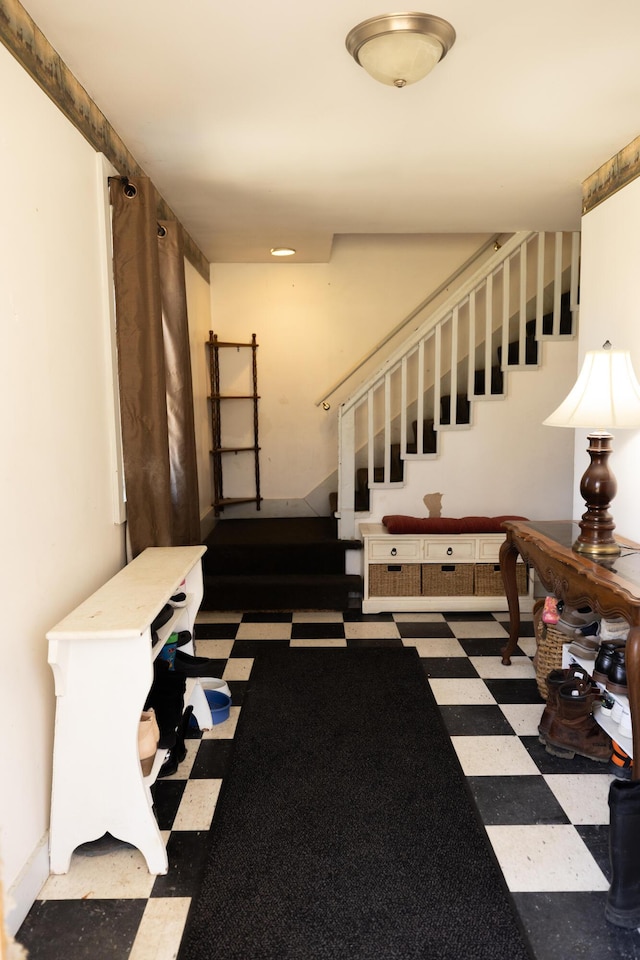 staircase with tile patterned floors