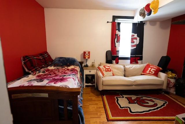 bedroom with wood finished floors