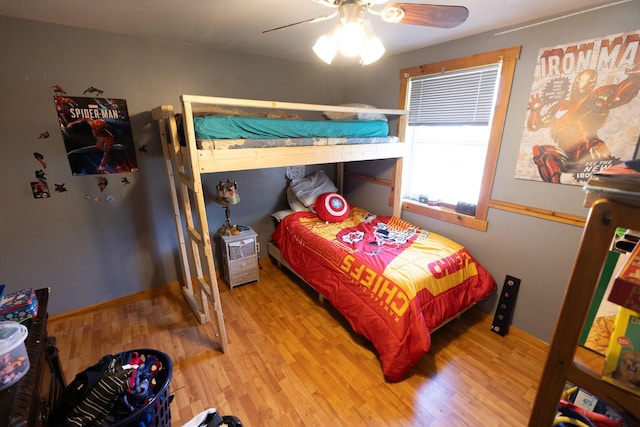 bedroom with ceiling fan and wood finished floors
